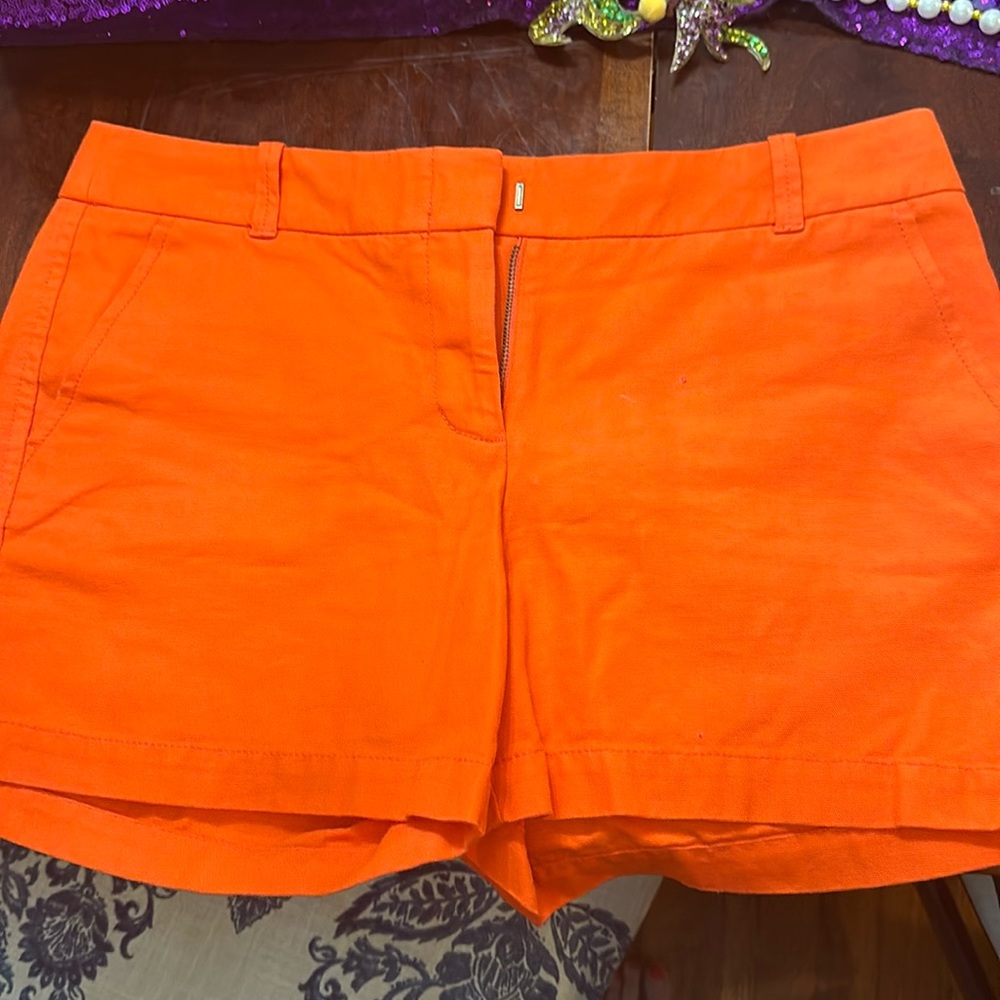 Orange J. Crew shorts.